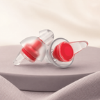DayHush QuietFit Reusable Earplugs on a warm cream and lavender studio set