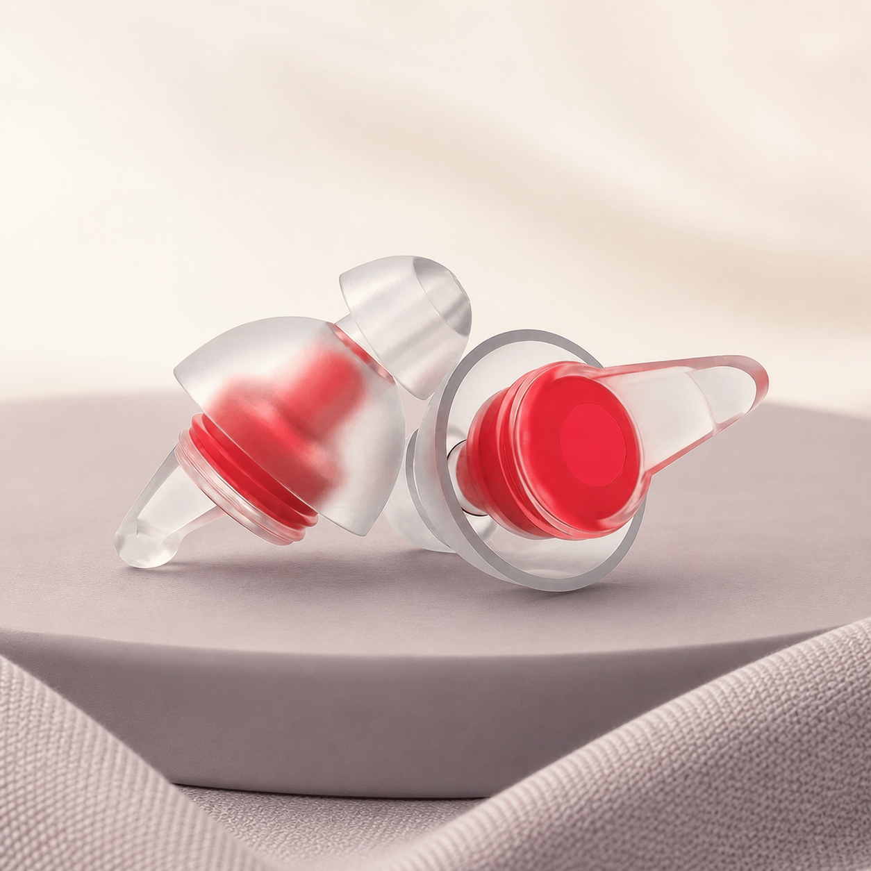 DayHush QuietFit Reusable Earplugs on a warm cream and lavender studio set